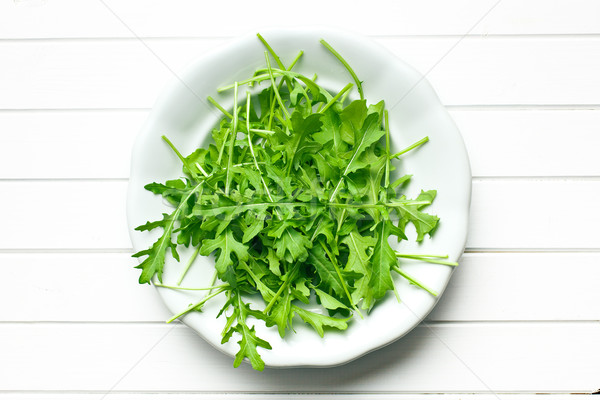 arugula leaves in plate Stock photo © jirkaejc