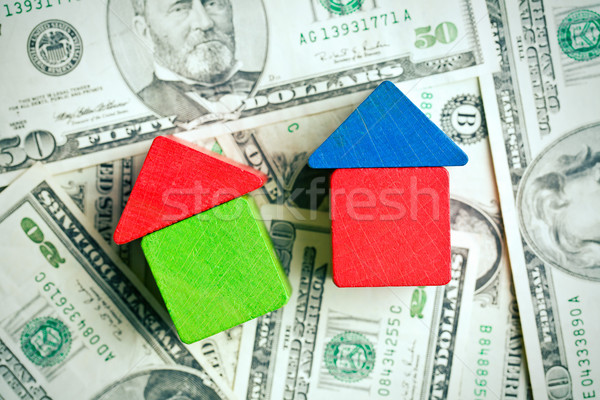 house made from wooden toy blocks on dollar background Stock photo © jirkaejc