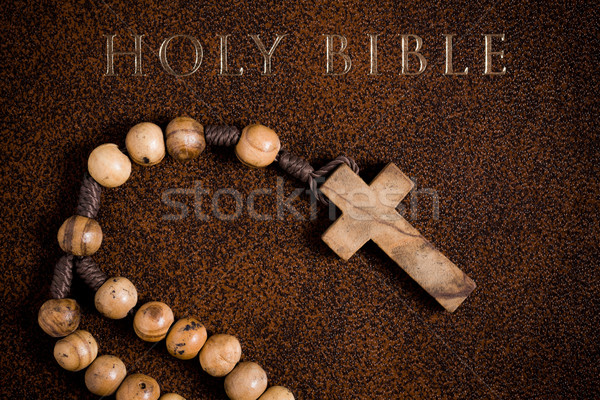 wooden rosary on the Bible Stock photo © jirkaejc