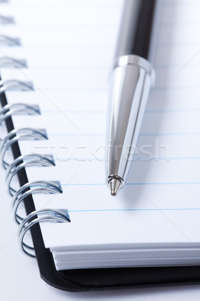Stock photo: black pen and notebook