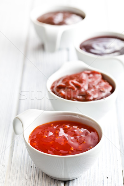 various barbecue sauces in ceramic bowls Stock photo © jirkaejc