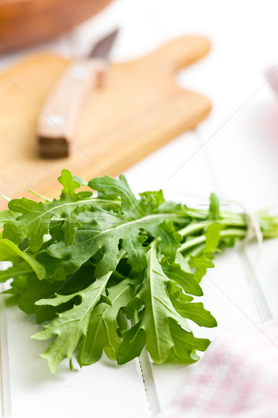 fresh arugula leaves on kitchen table Stock photo © jirkaejc