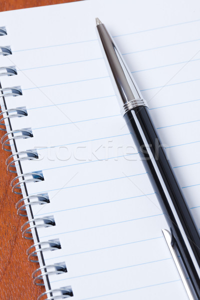 Stock photo: black pen and notebook