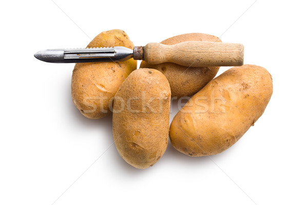 wooden peeler and potatoes Stock photo © jirkaejc