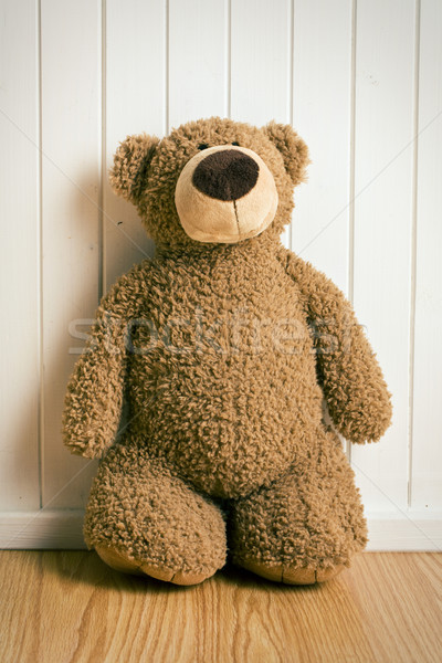 teddy bear in front of  old wooden wall Stock photo © jirkaejc
