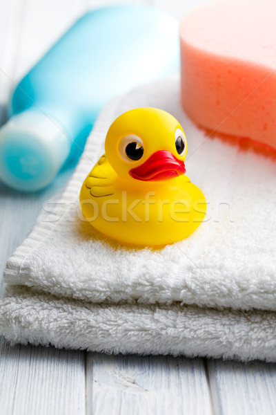 yellow bath duck on white towel Stock photo © jirkaejc