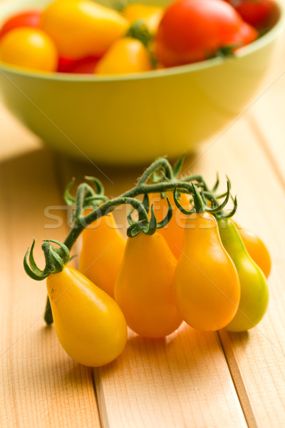 yellow tomatoes on wooden table Stock photo © jirkaejc