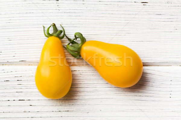 yellow tomatoes on wooden table Stock photo © jirkaejc