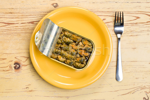 Stock photo: smoked mussels in opened tin can