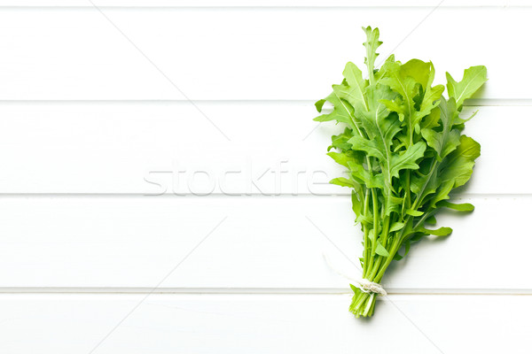 fresh arugula leaves on kitchen table Stock photo © jirkaejc