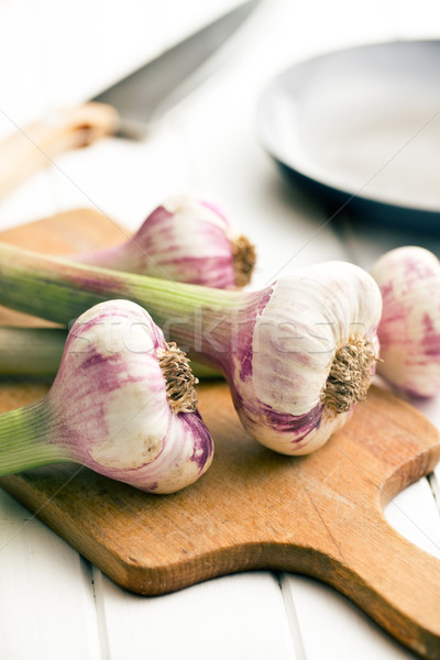fresh garlic on cutting bard Stock photo © jirkaejc