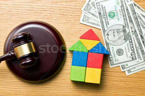 wooden house with money and judge gavel Stock photo © jirkaejc