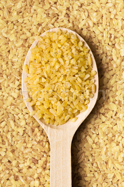 bulgur wheat in wooden spoon Stock photo © jirkaejc