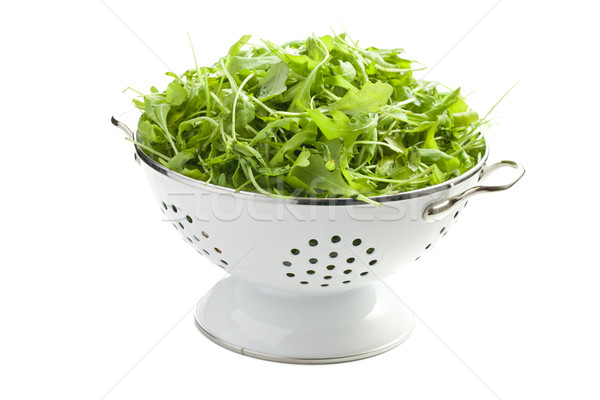 arugula leaves in white colander Stock photo © jirkaejc