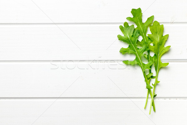 fresh arugula leaves on kitchen table Stock photo © jirkaejc
