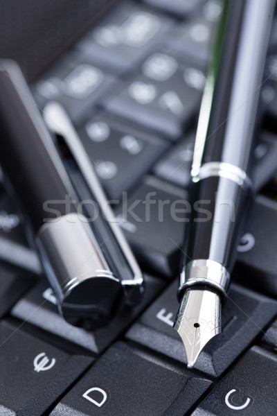 luxury black pen on computer keyboard Stock photo © jirkaejc