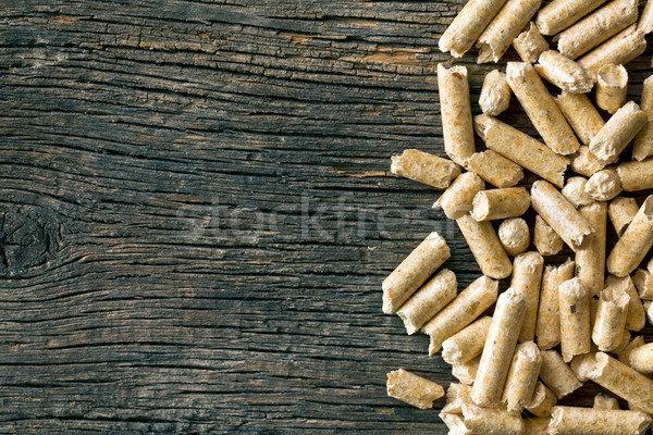 wooden pellets on old wooden background Stock photo © jirkaejc