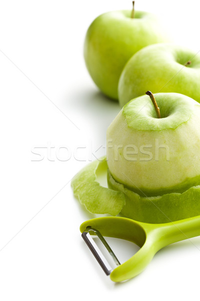 peeled green apple with peeler Stock photo © jirkaejc