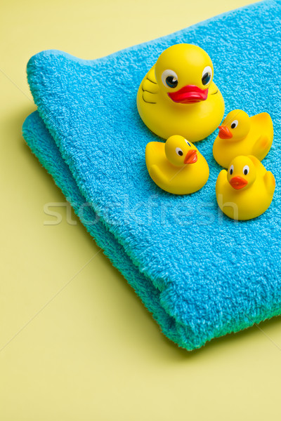 yellow bath duck on blue towel Stock photo © jirkaejc