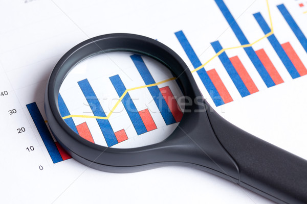 magnifying glass focusing on business graph Stock photo © jirkaejc