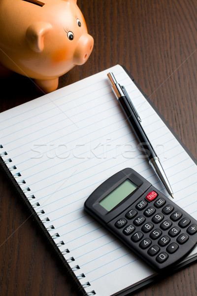 Stock photo: calculator and blank notebook