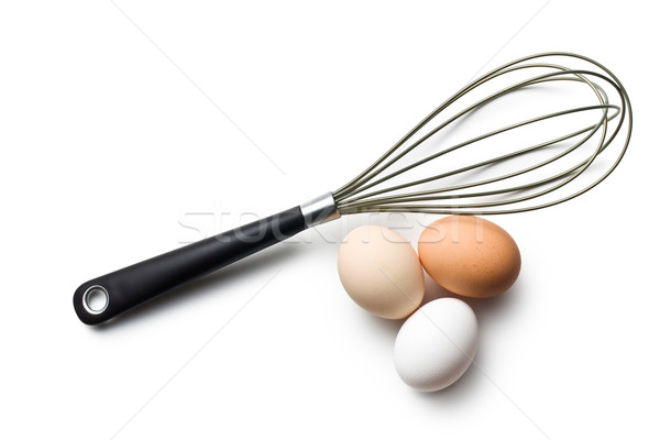 three eggs and whisk Stock photo © jirkaejc