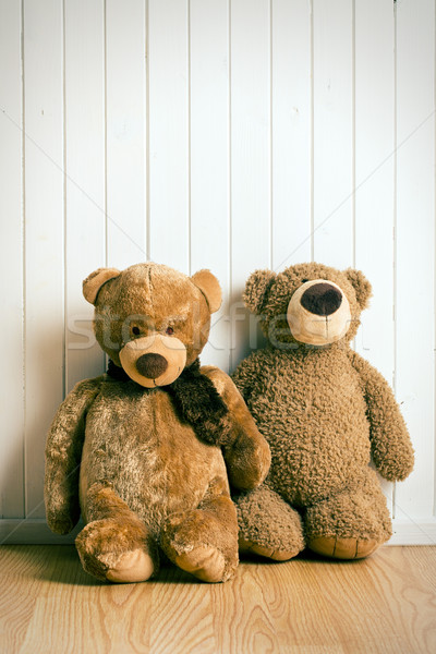 teddy bears in front of  old wooden wall Stock photo © jirkaejc