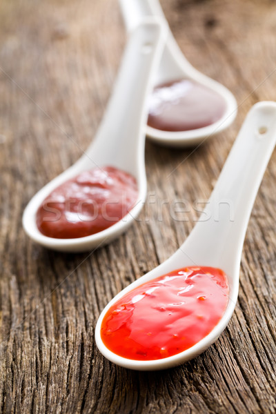 various barbecue sauces in ceramic spoons Stock photo © jirkaejc