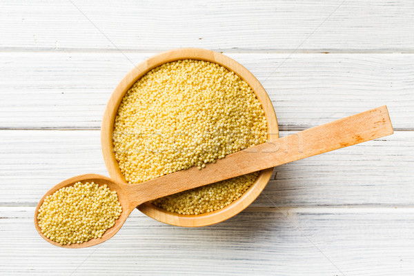 millet in wooden spoon Stock photo © jirkaejc