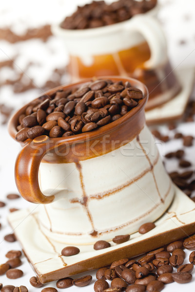 coffee beans in ceramic cup Stock photo © jirkaejc