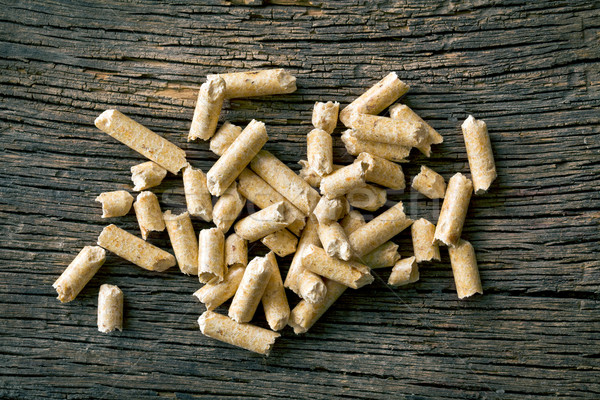 wooden pellets on old wooden background Stock photo © jirkaejc