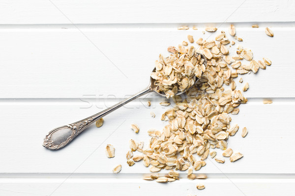 oat flakes in spoon Stock photo © jirkaejc