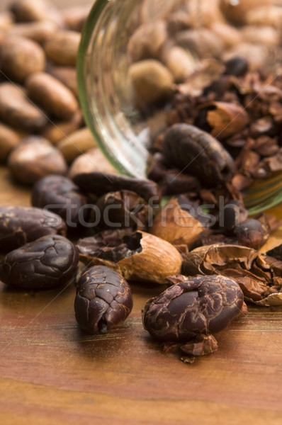 Stock photo: Cocoa (cacao) beans on natural wooden table