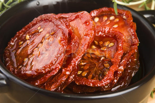 Sun dried tomatoes with olive oil Stock photo © joannawnuk