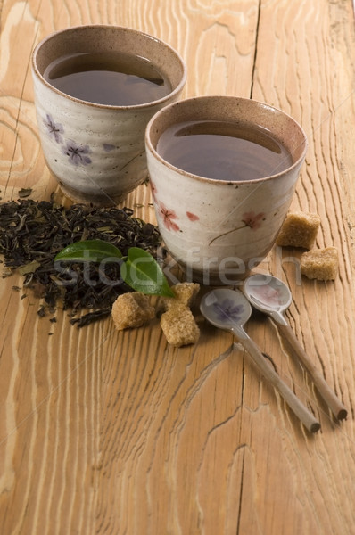 Groene thee blad thee goud beker japans Stockfoto © joannawnuk