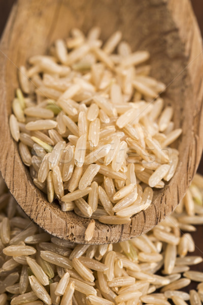 Spoon of brown rice close up Stock photo © joannawnuk