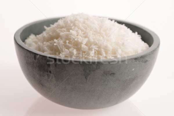 Coconut flakes in ceramic bowl Stock photo © joannawnuk