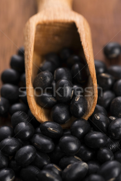A lot of black soybeans on wooden background Stock photo © joannawnuk