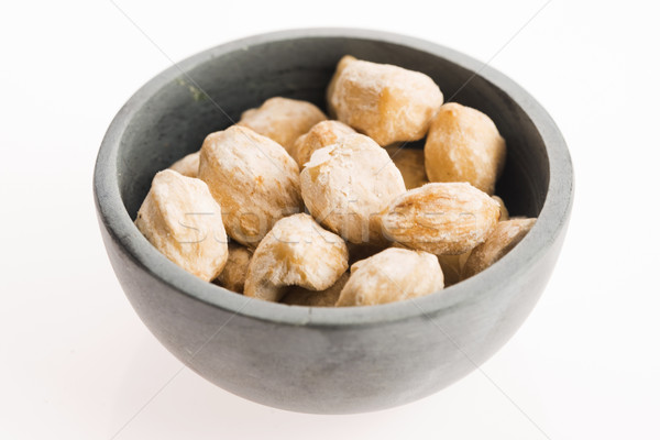 Candlenut or Kukui is a spice especially used in indonesian cook Stock photo © joannawnuk