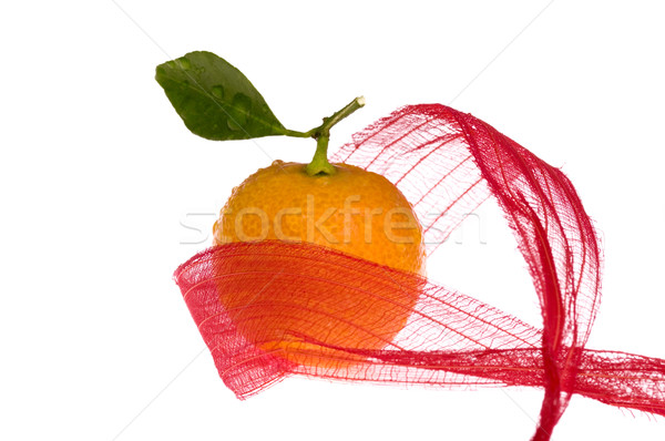 christmas sweet in red bow. orange fruit Stock photo © joannawnuk
