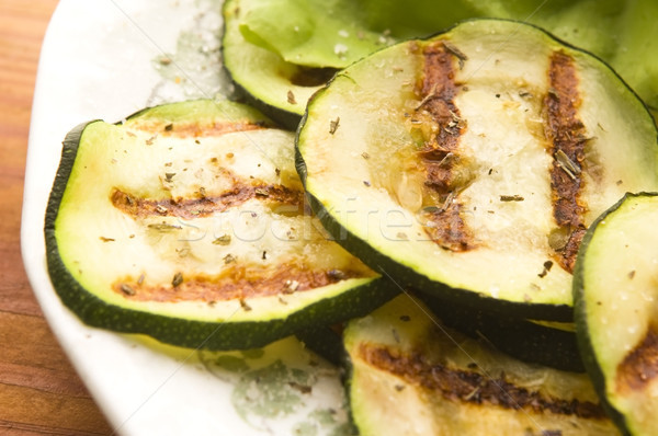 Grilled organic zucchini slices with herbs and spices Stock photo © joannawnuk