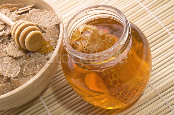 Friss méz méhsejt reggeli pelyhek étel Stock fotó © joannawnuk