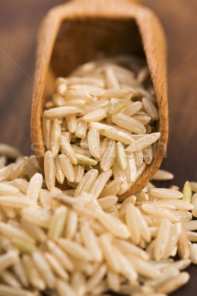 Spoon of brown rice close up Stock photo © joannawnuk