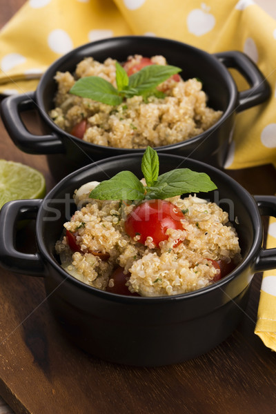 Tabbouleh Quinoa with tomatoes, onion, mint, parsley and lemon Stock photo © joannawnuk