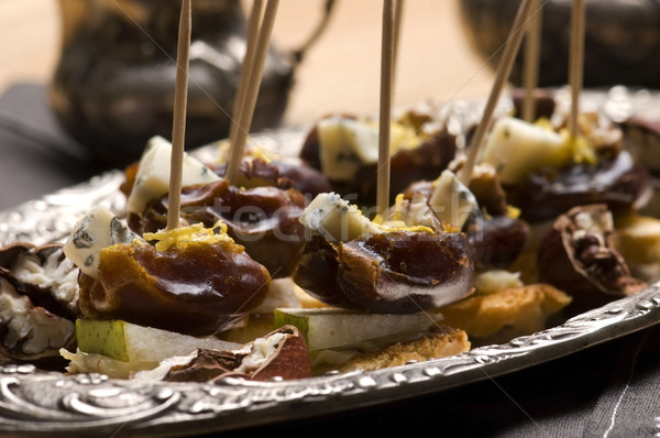 Appetizer Plate with Dactyl, Pecan nuts and Cheese Stock photo © joannawnuk