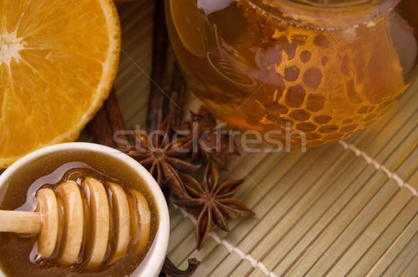 fresh honey with honeycomb, spices and fruits Stock photo © joannawnuk