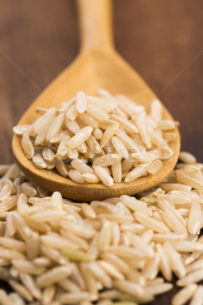 Spoon of brown rice close up Stock photo © joannawnuk