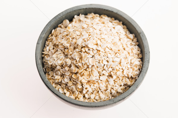 Oat flakes in bowl Stock photo © joannawnuk