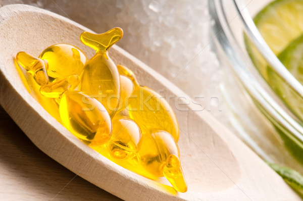 lemon bath - bath salt, capsule and fresh fruits Stock photo © joannawnuk