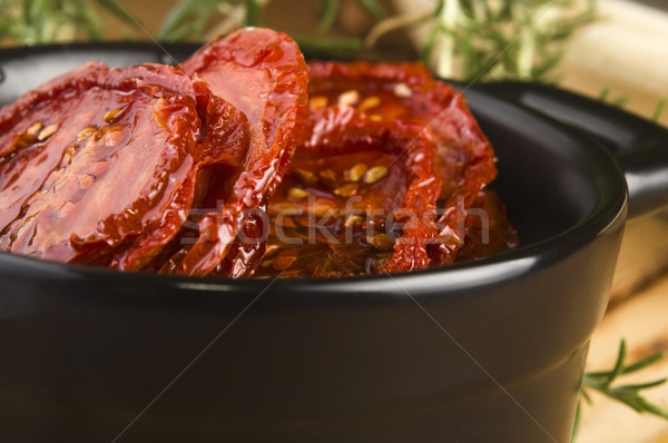 Sun dried tomatoes with olive oil Stock photo © joannawnuk
